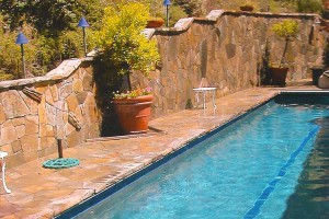 retaining wall beside custom lap pool